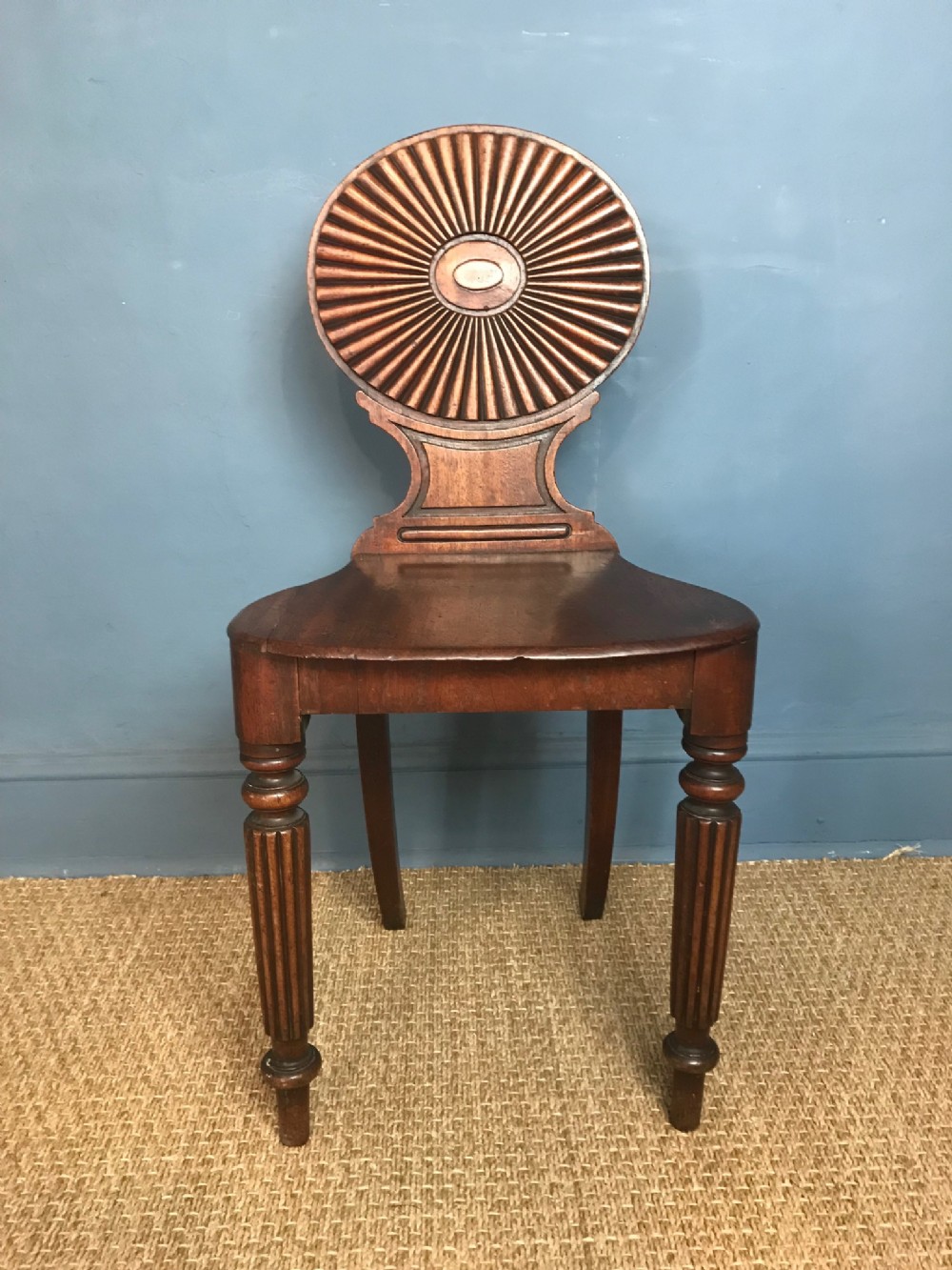 A Regency mahogany hall chair circa 1820 with fan back in the style of Ince and Mayhew