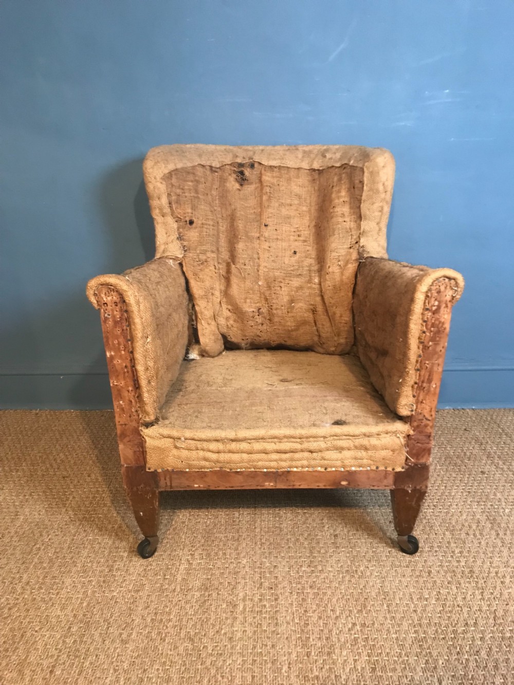 An Edwardian mahogany library chair circa 1910 stripped back ready for re-upholstery . View II