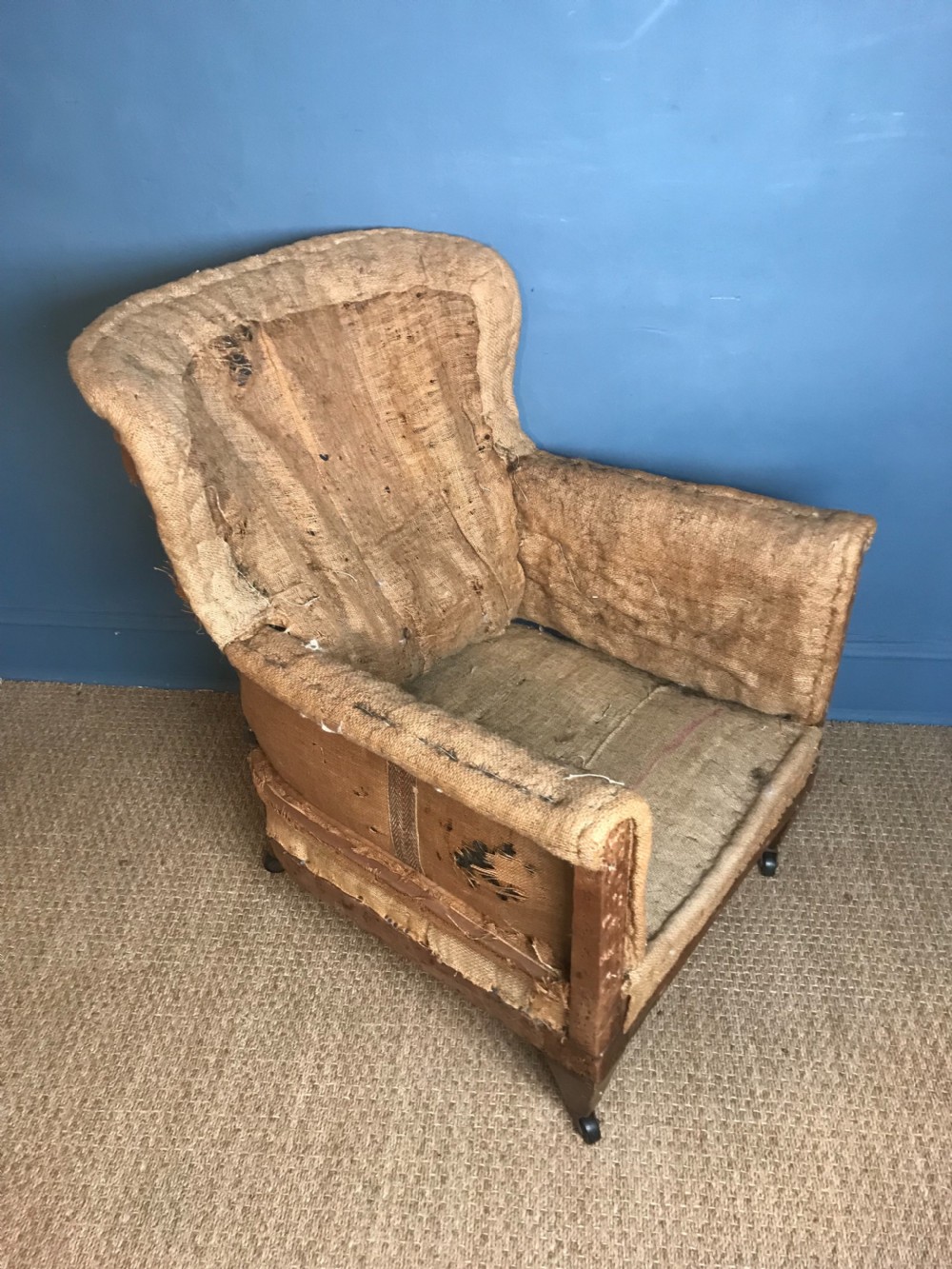 An Edwardian mahogany library chair circa 1910 stripped back ready for re-upholstery . View III
