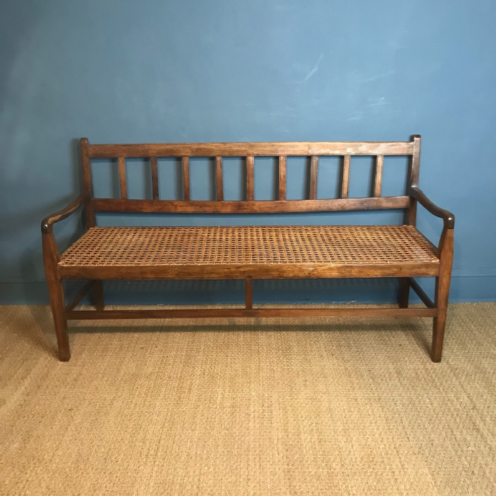 A South African stink wood and rattan seated sofa circa 1910 in excellent solid condition. View II