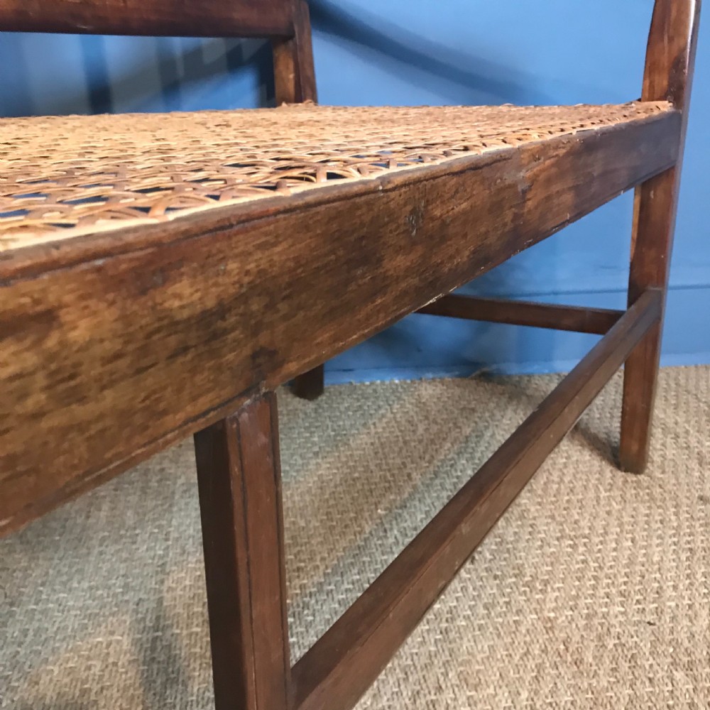 A South African stink wood and rattan seated sofa circa 1910 in excellent solid condition. View IV