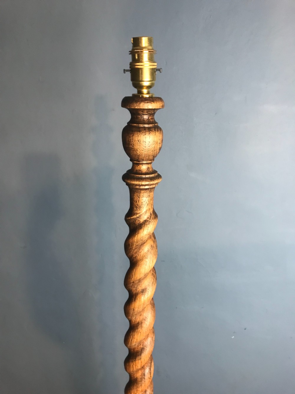 A 1920s oak barley twist standard lamp in the style of Heals View II
