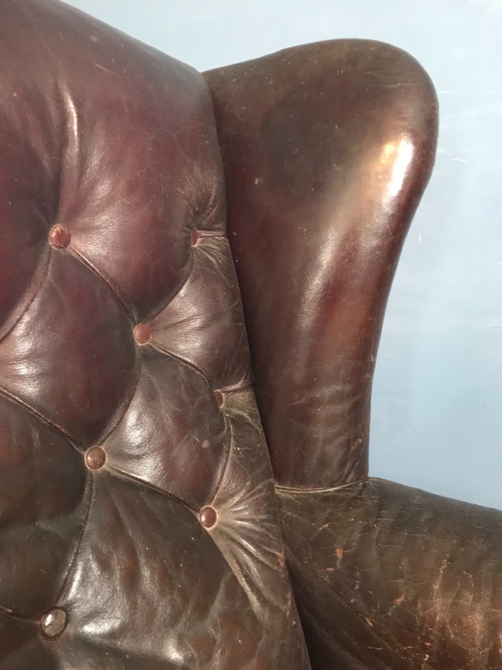 A late Victorian leather wing armchair c 1890 with the original burgundy leather  View II