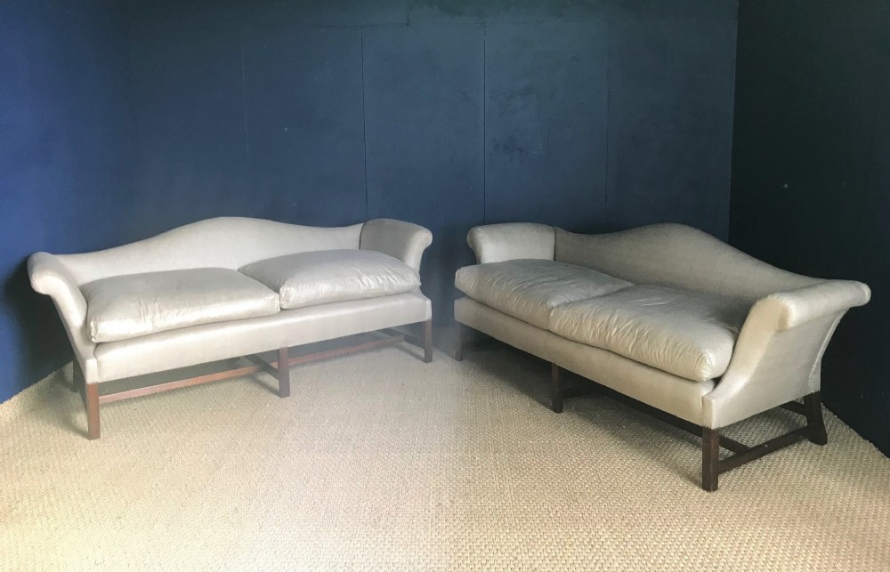 A pair of 19th c mahogany Camel Back Sofas in early George 111 style
