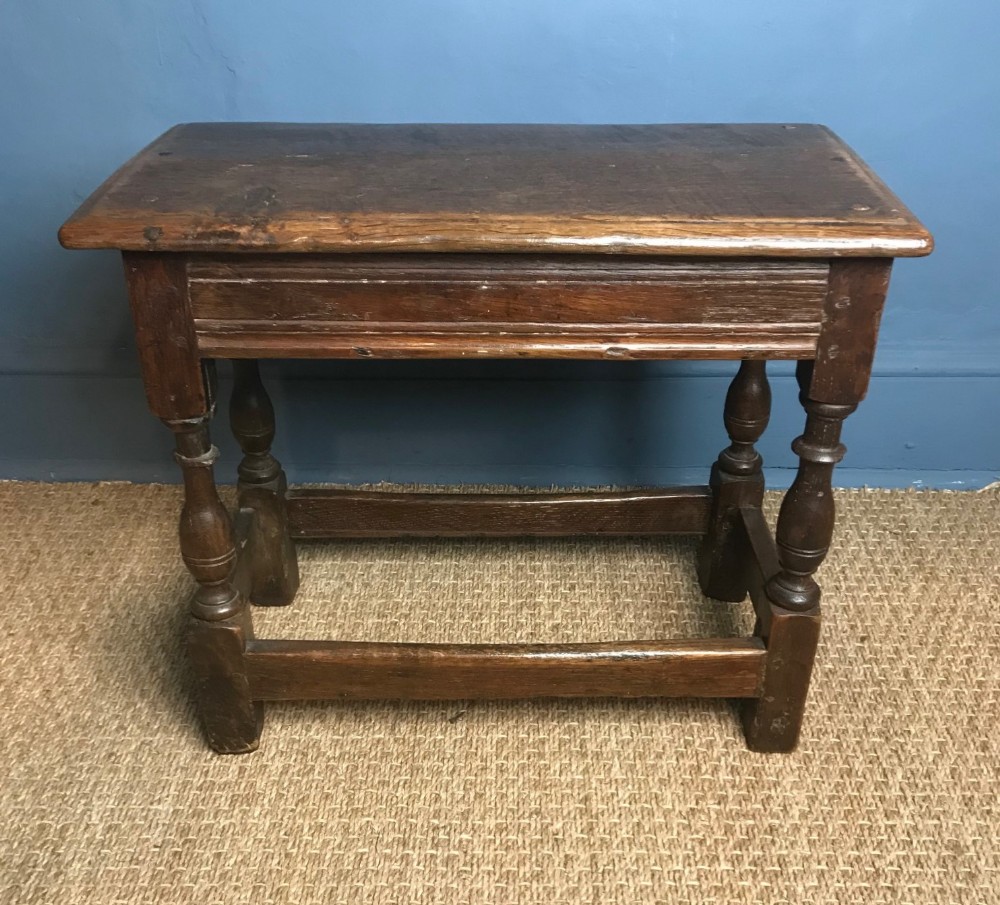 A William and Mary oak joint stool circa 1690.