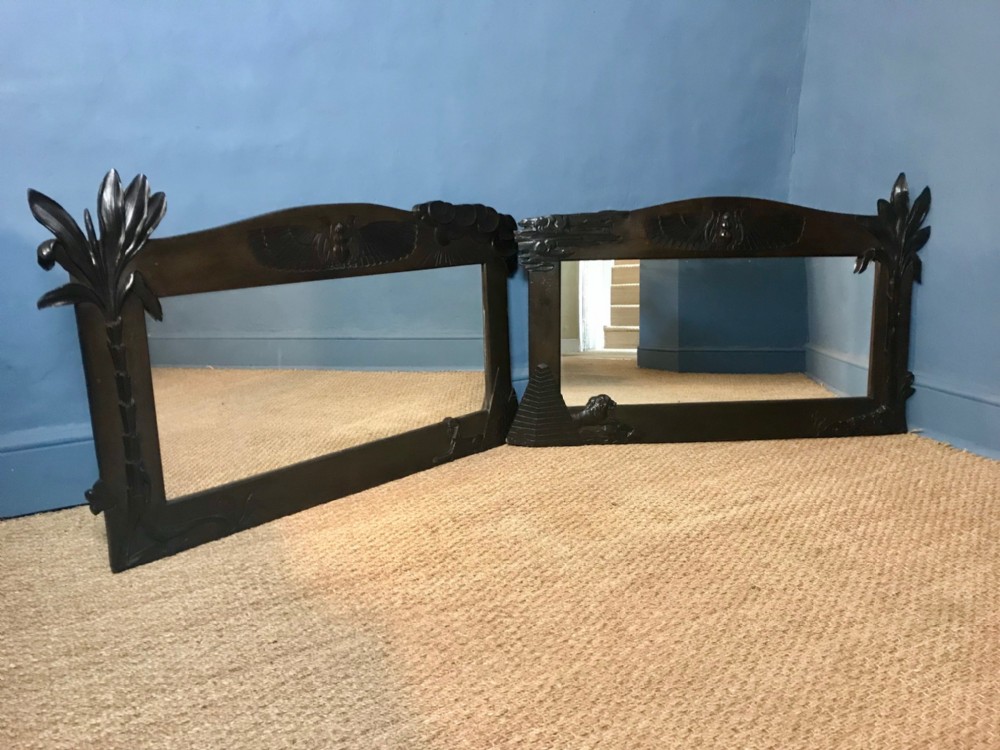 An unusual pair of Egyptian style ebonised mahogany mirrors circa 1925