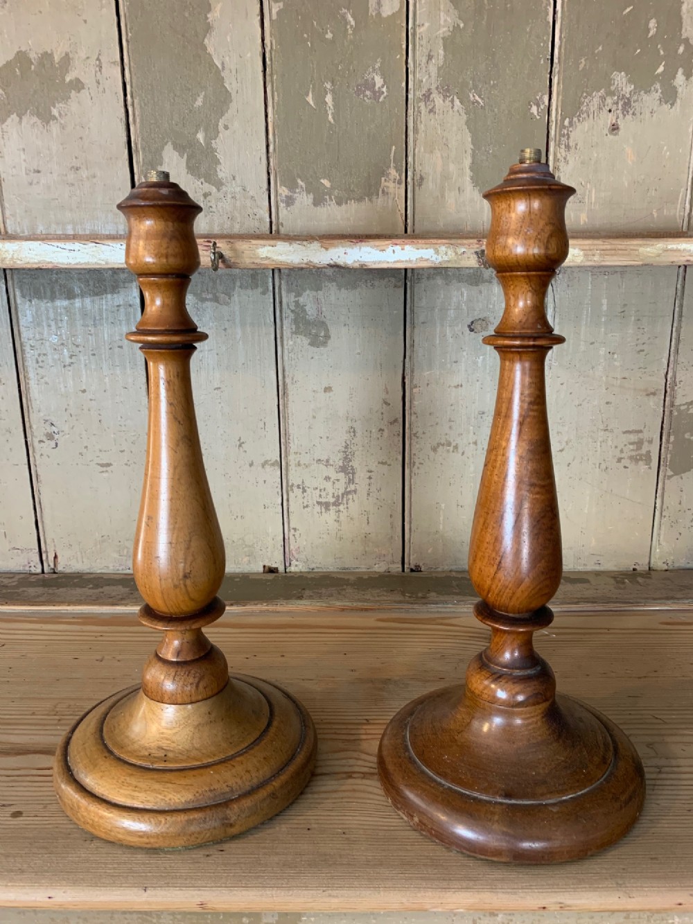A matched pair of Edwardian walnut table lamps circa 1910.