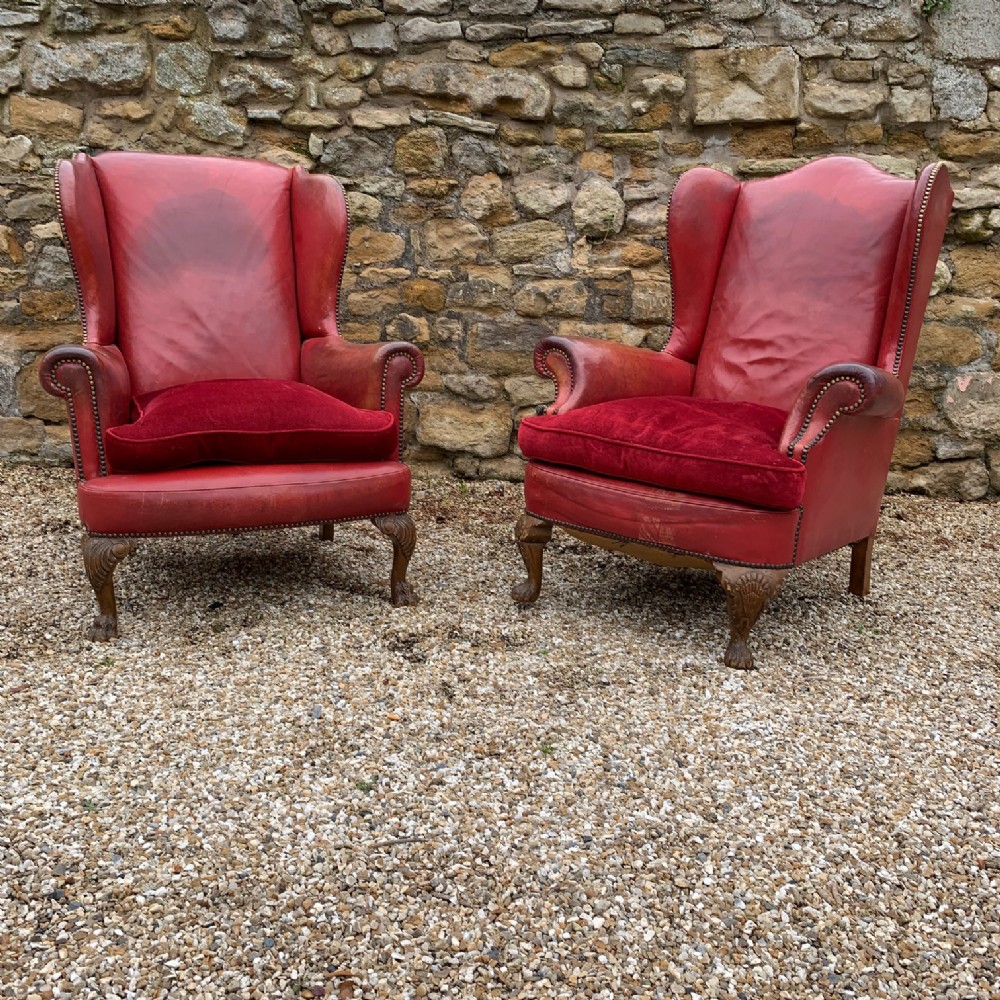 A pair of Edwardian leather wing armchairs circa 1910