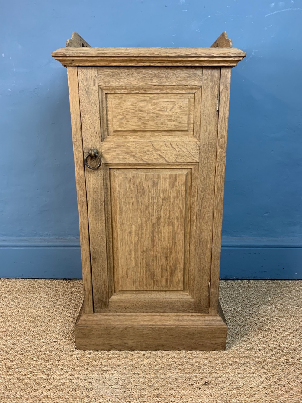 A Howard and Sons dry oak bedside table circa 1890