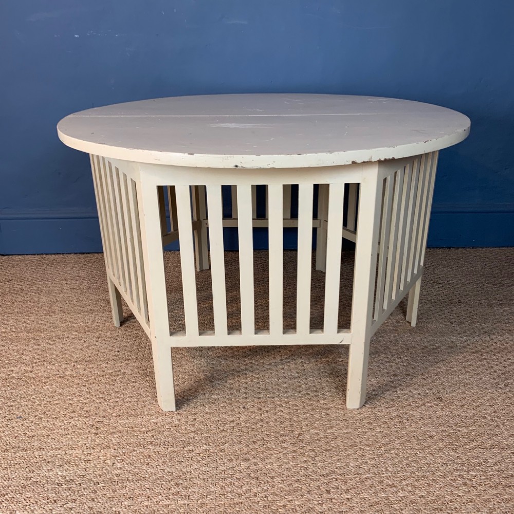 A large Glasgow School low white painted table circa 1910 in the style of Charles Rennie Mackintosh 