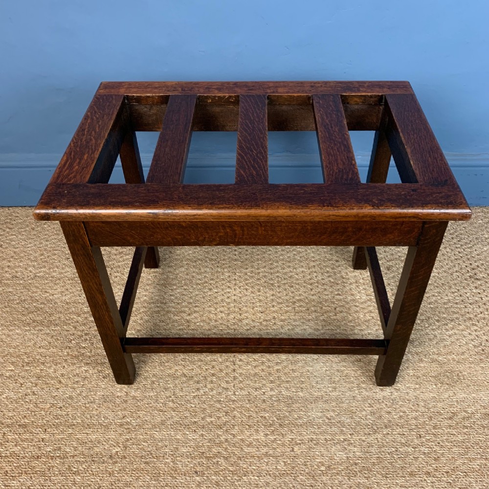 An  Edwardian walnut luggage rack circa 1910