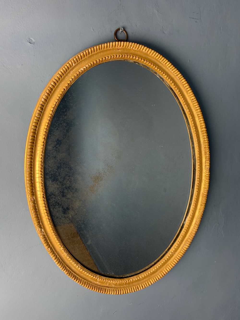 A small Regency gilt oval mirror circa 1810