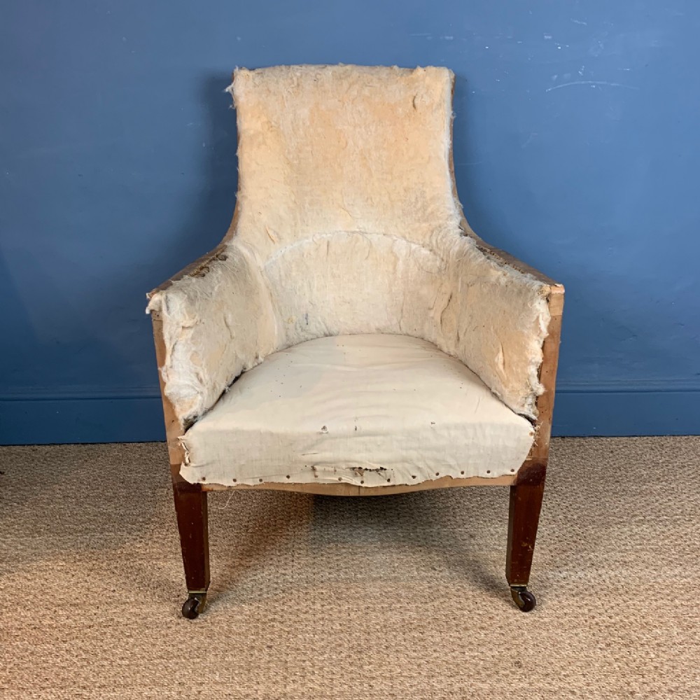 A 19th century mahogany bergere chair by Shoolbred circa 1880 