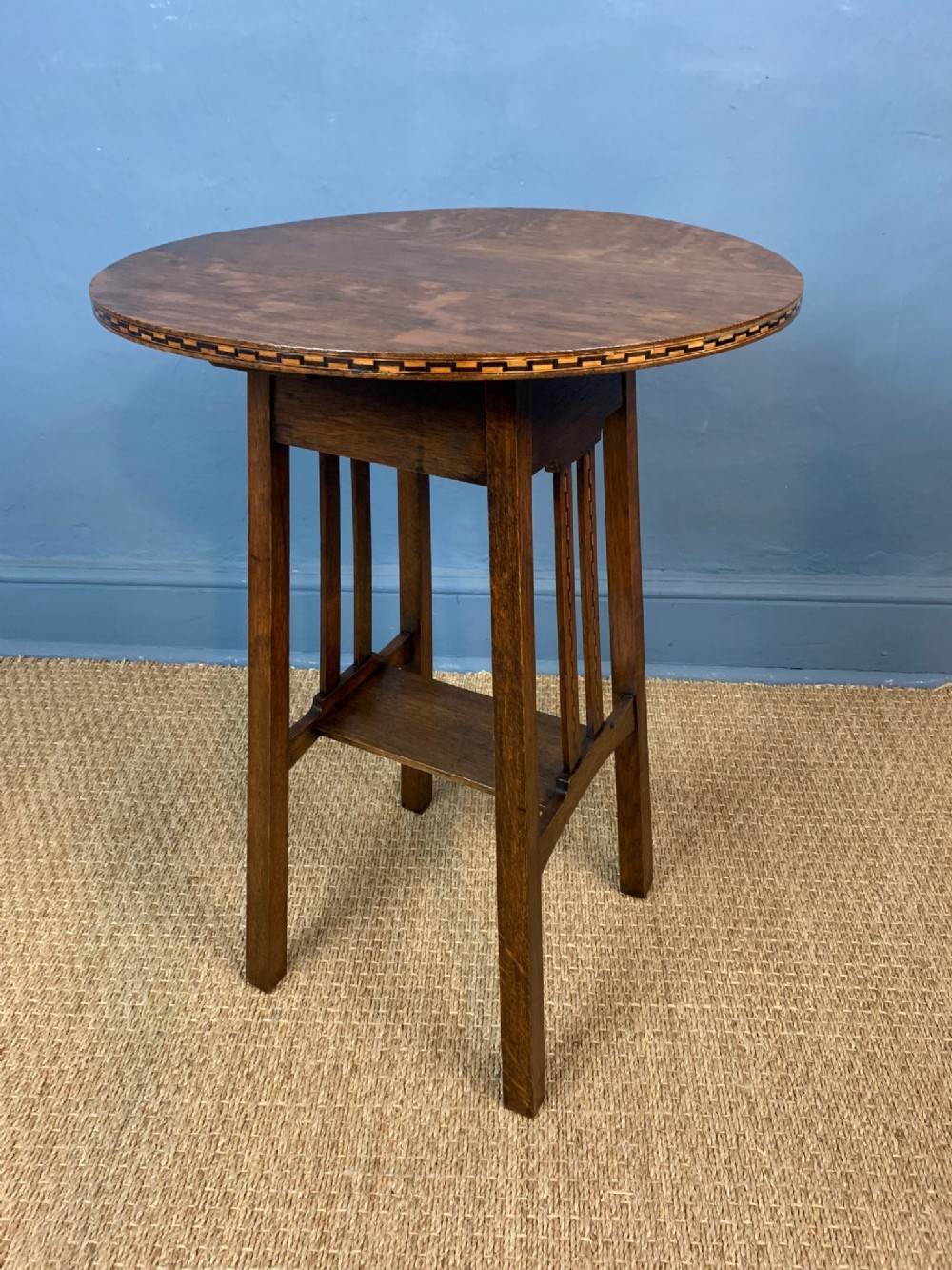A Glasgow School oak and chequer strung lamp table in the style of Mackay Hugh Baillie Scott circa 1900