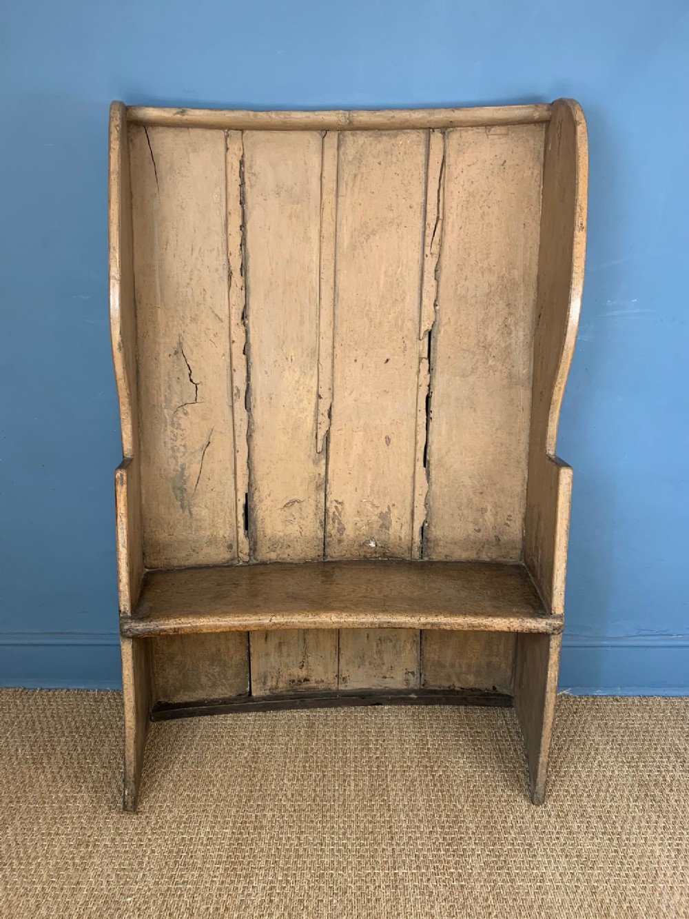 A small West Country painted elm settle circa 1800