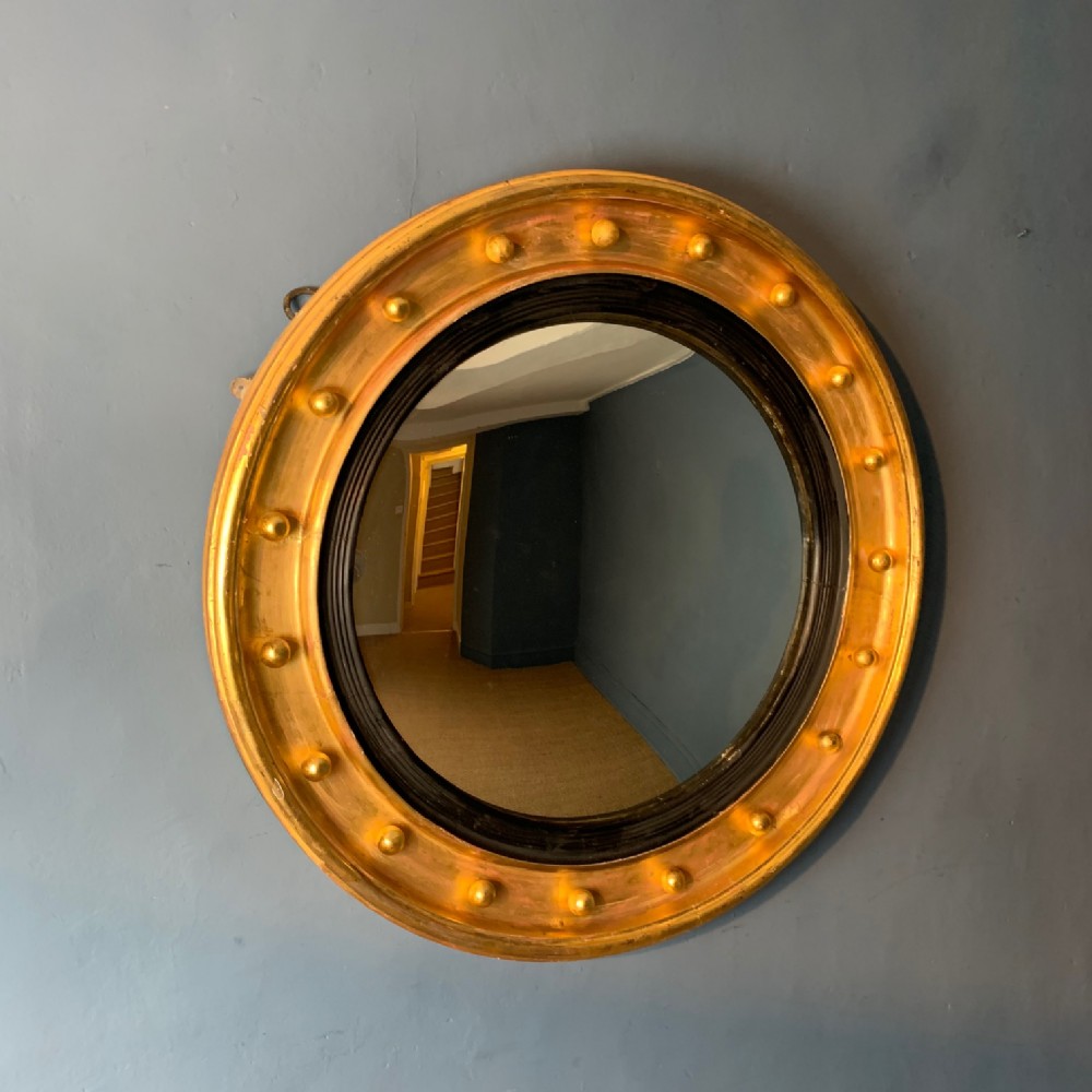 A large mid 19th c gilt convex mirror circa 1860