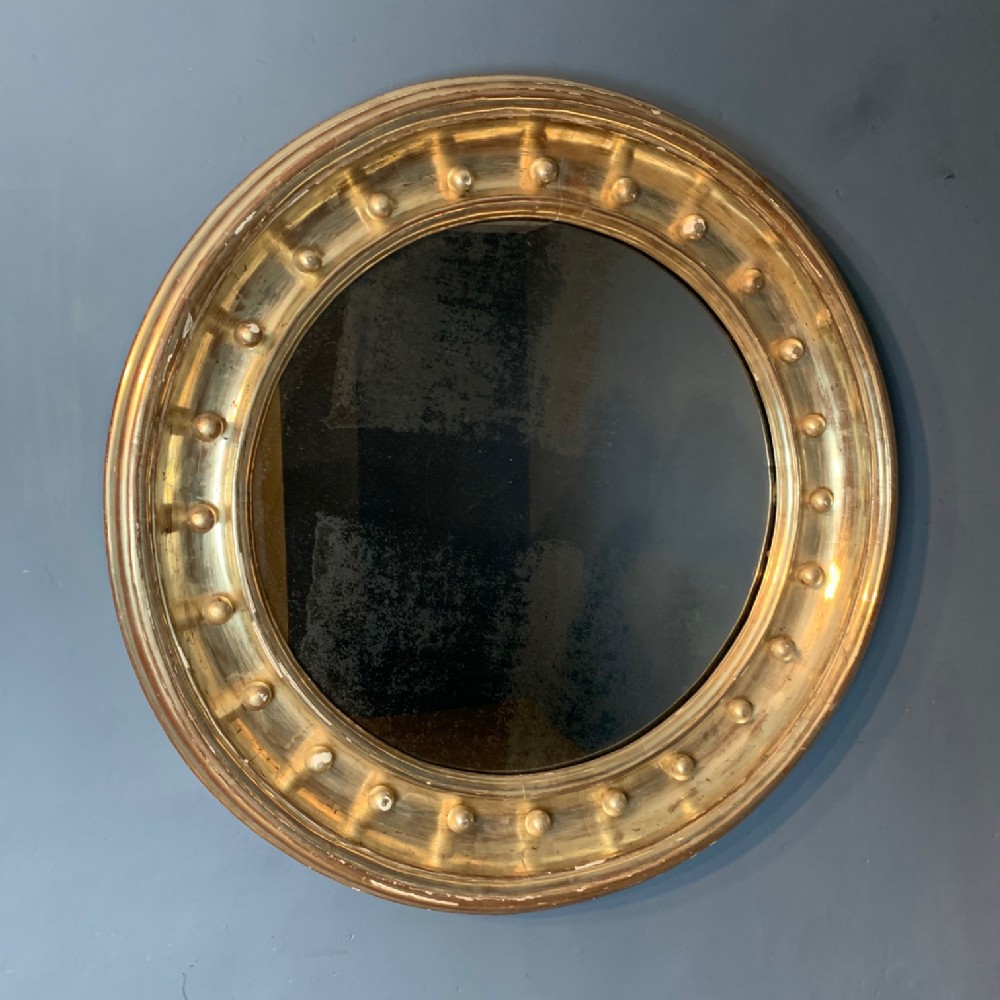A very large Regency style silver gilt Circular mirror circa 1820