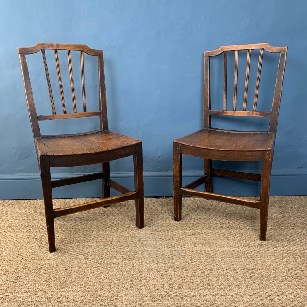 A pair of late Georgian Country Sheraton stick back chairs circa 1820