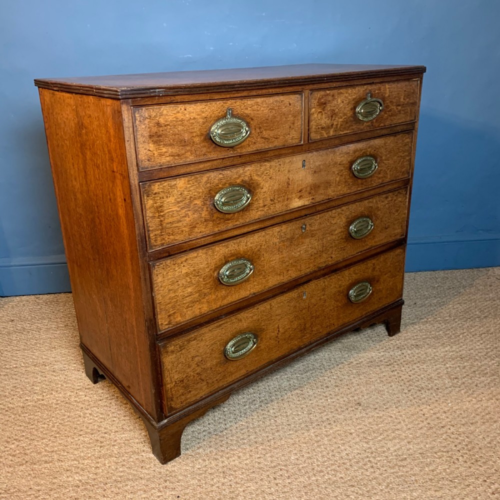 A George 111 oak chest of drawers circa 1820 View III