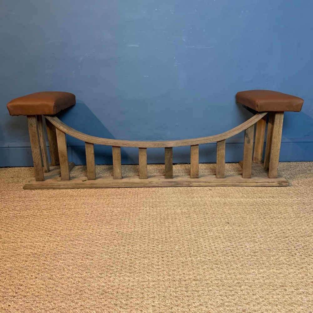 An Edwardian oak and leather Club Fender circa 1910.
