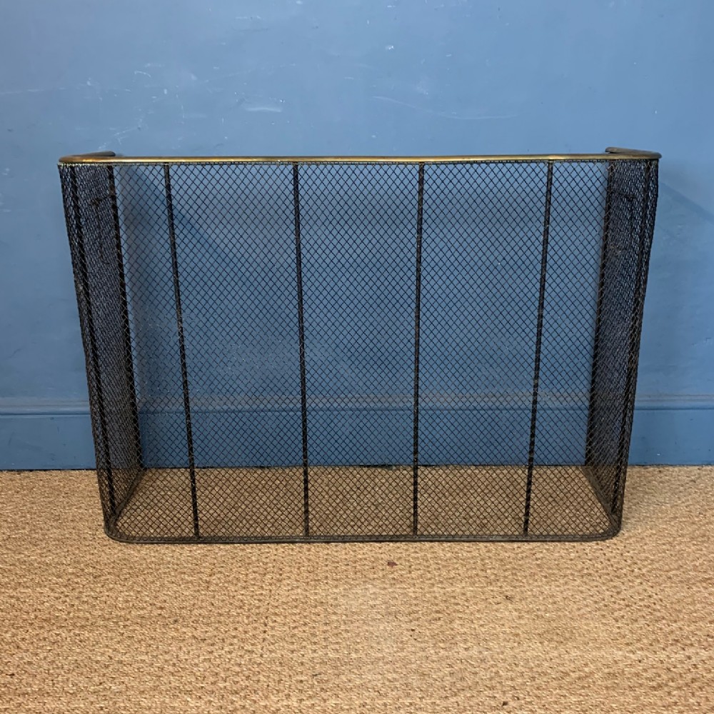 A mid 19th century brass and iron nursery fender.