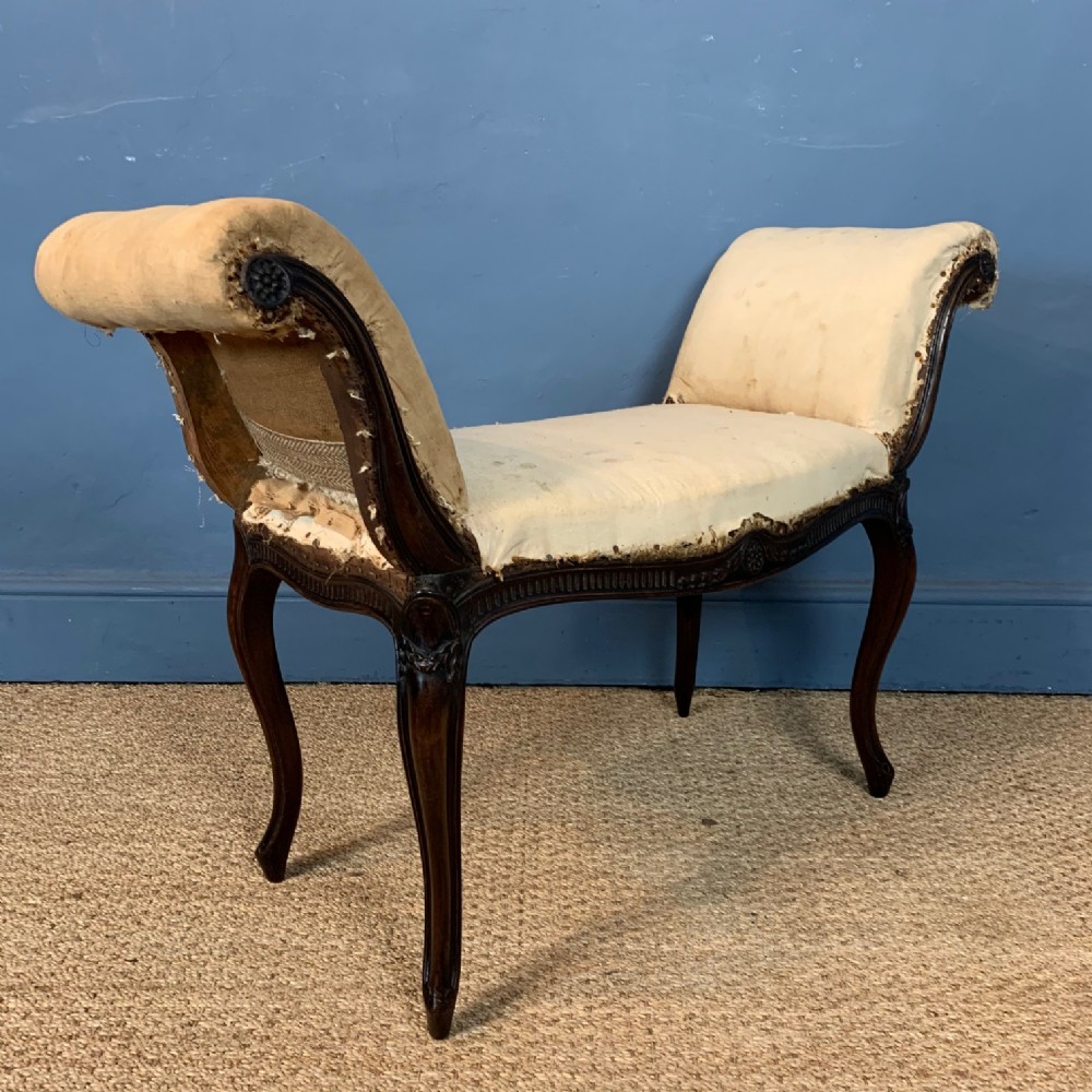 A late 19th century mahogany window seat 