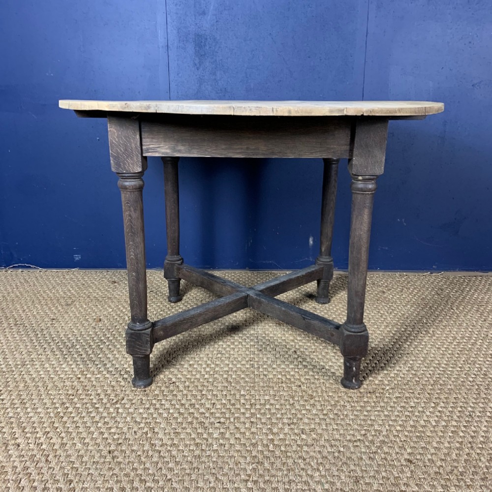 A Heals dry oak circular table circa 1910