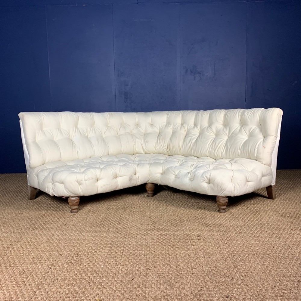 A rare Howard and Sons oak corner sofa circa 1900