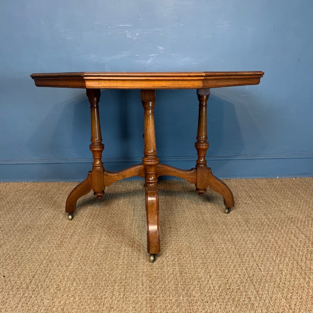 An Aesthetic Movement walnut octagonal centre table circa 1880 in reformed Gothic style.