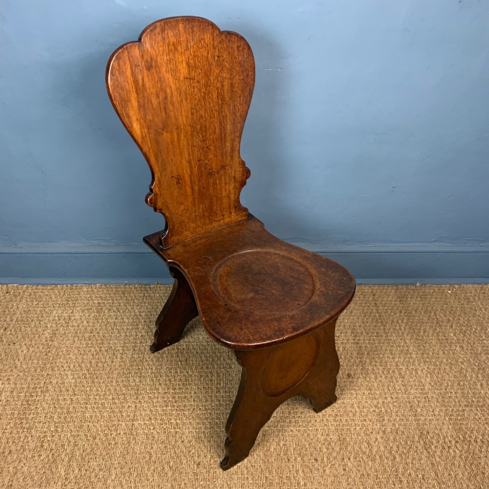 An early George 111 mahogany hall chair circa 1770 of Sgabello type
