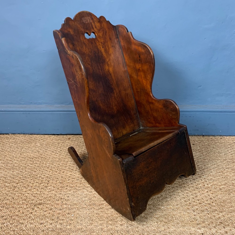 A early 19th century North country fruitwood Childs rocking chair