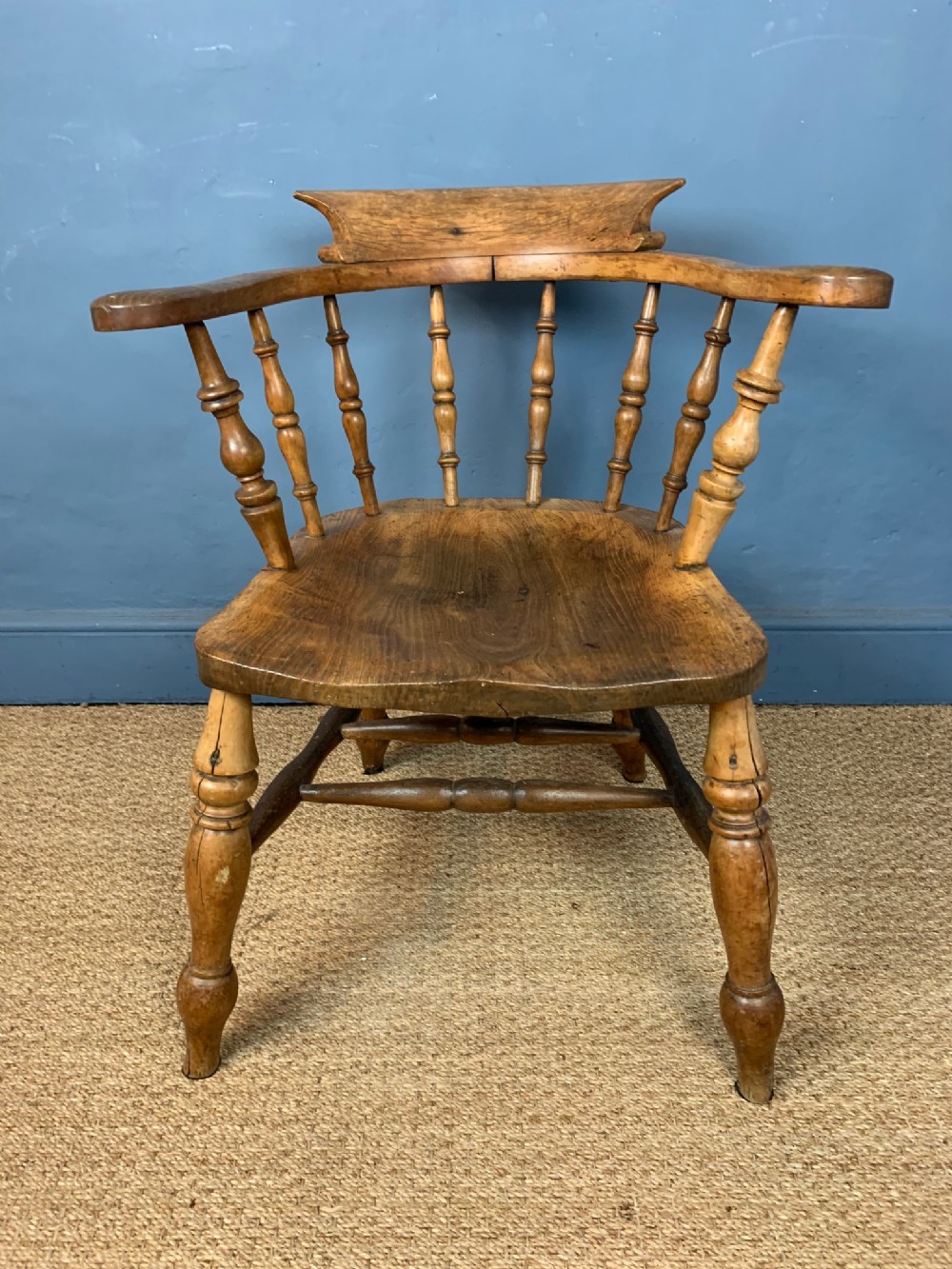A late 19th century smokers bow armchair