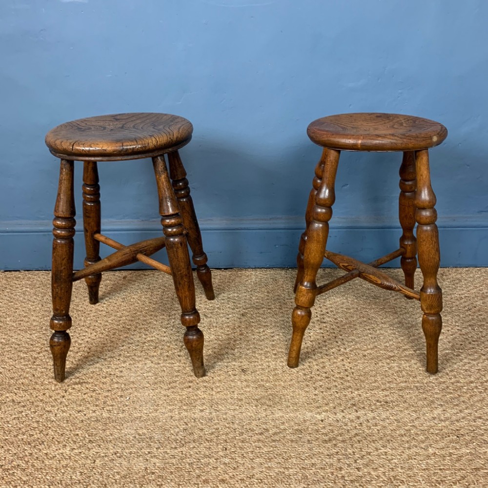 A pair of late 19th century elm Lincolnshire stools