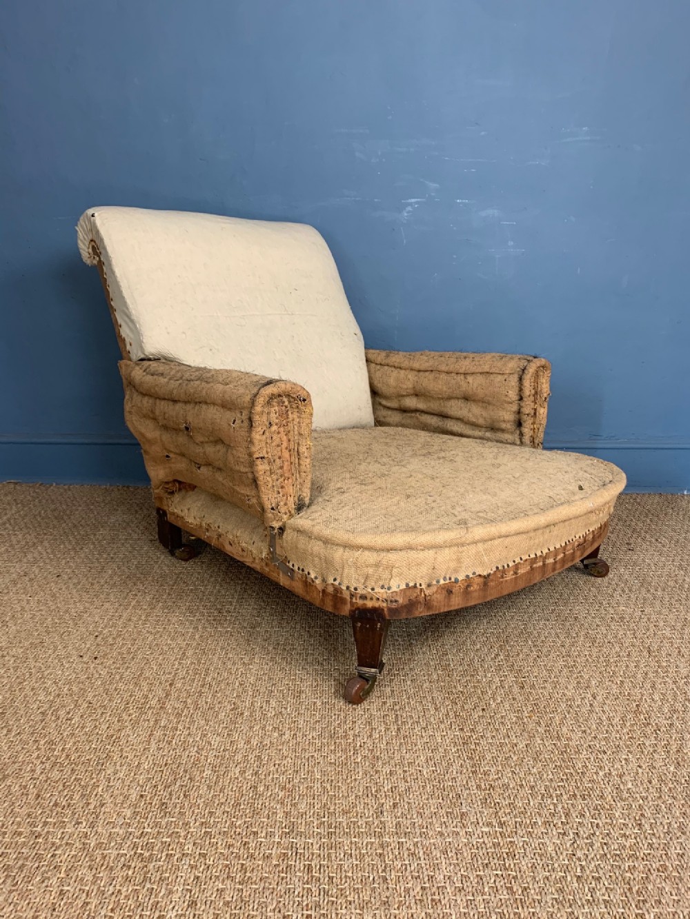 A large deep-seated Edwardian mahogany armchair circa 1910