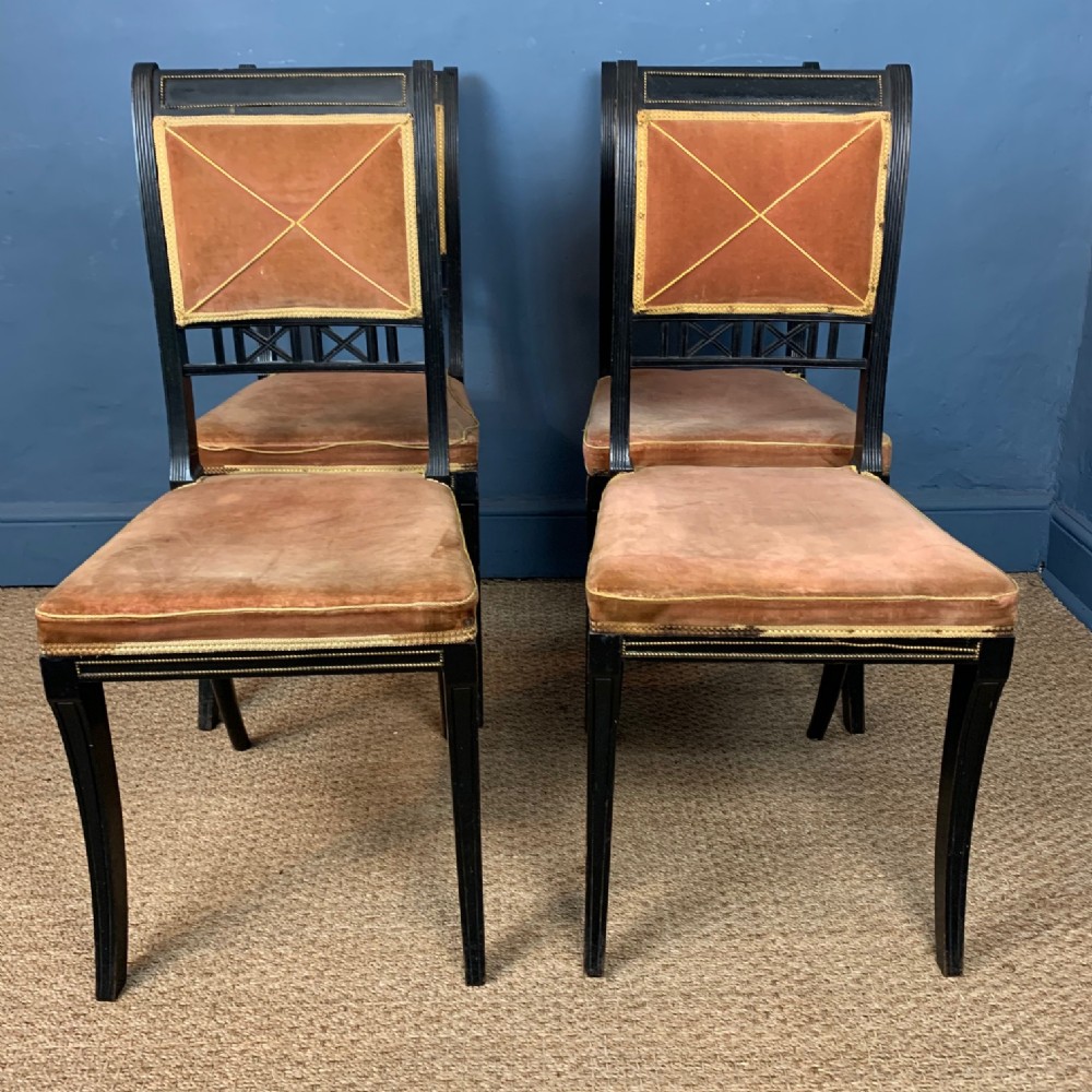 A set of four Regency ebonised dining chairs circa 1830