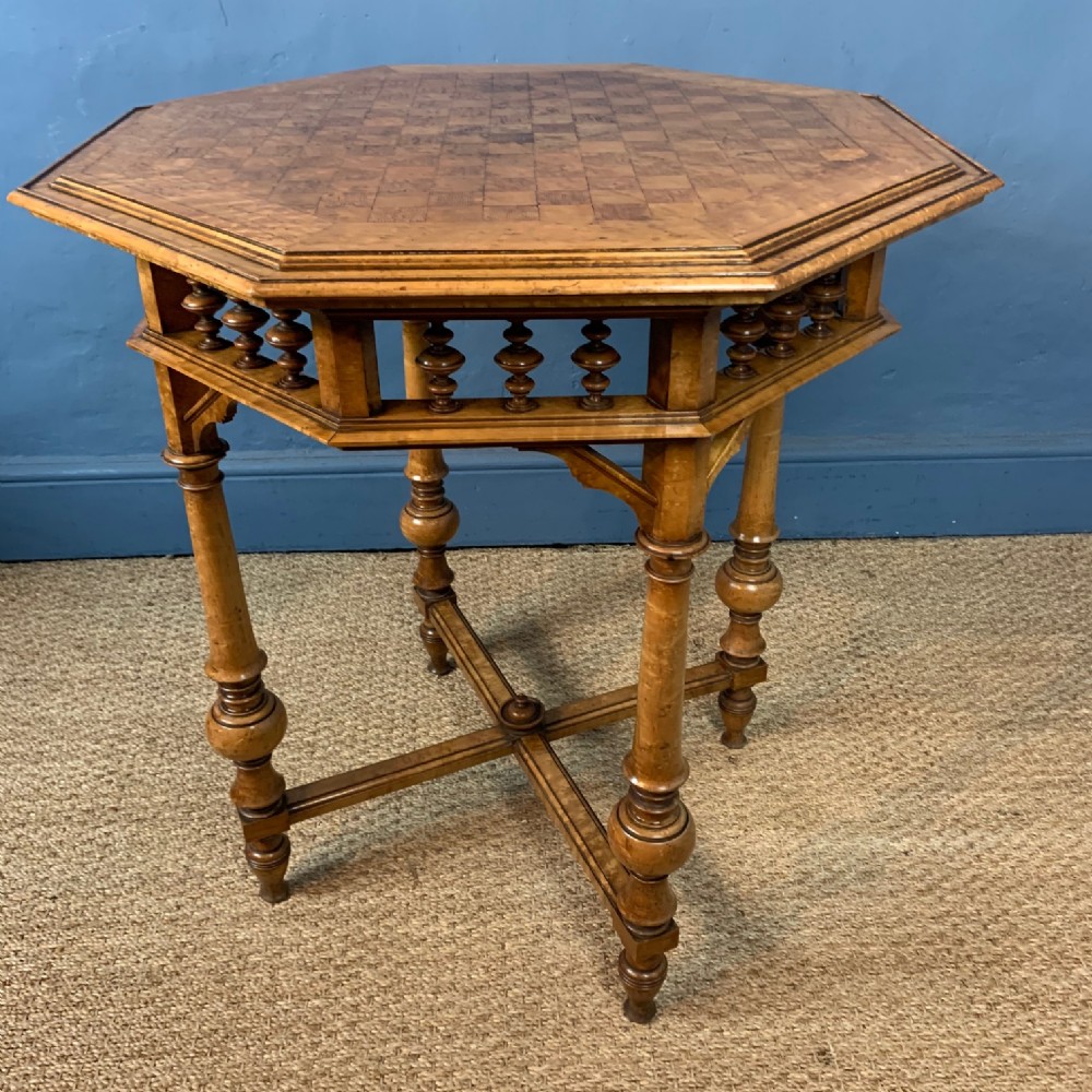 A Victorian birds eye maple parquetry octagonal table circa 1880