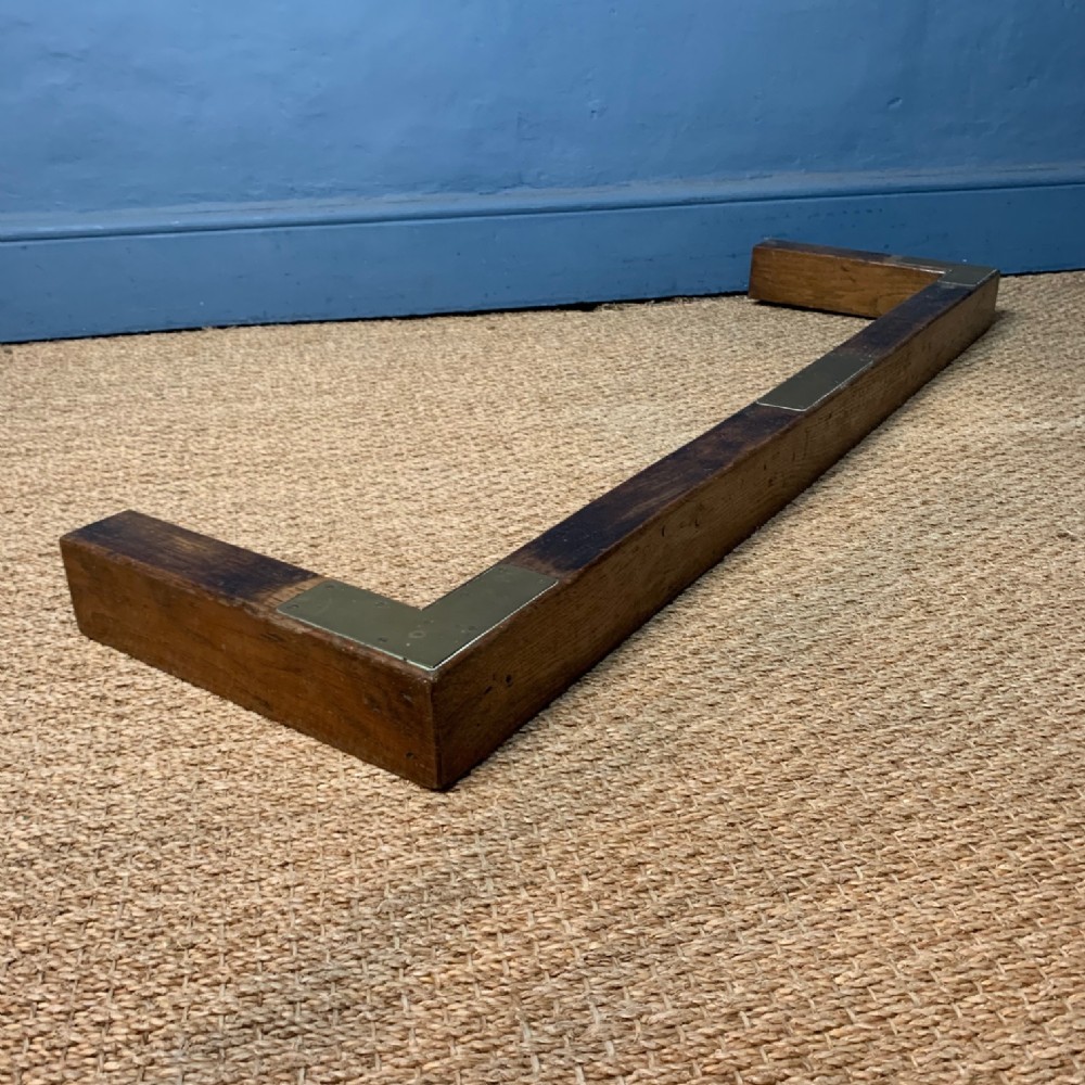A late Victorian oak and brass kerb fender circa 1900