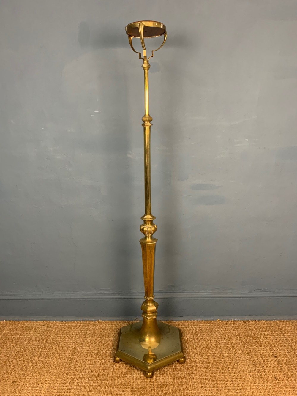 An Edwardian brass telescopic Standard Lamp Circa 1910 in early Georgian style