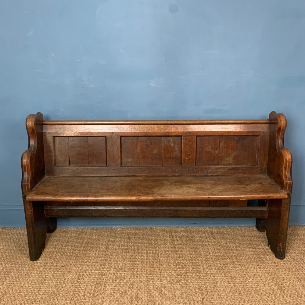 A late 19th century small oak Hall bench or pew c 1890
