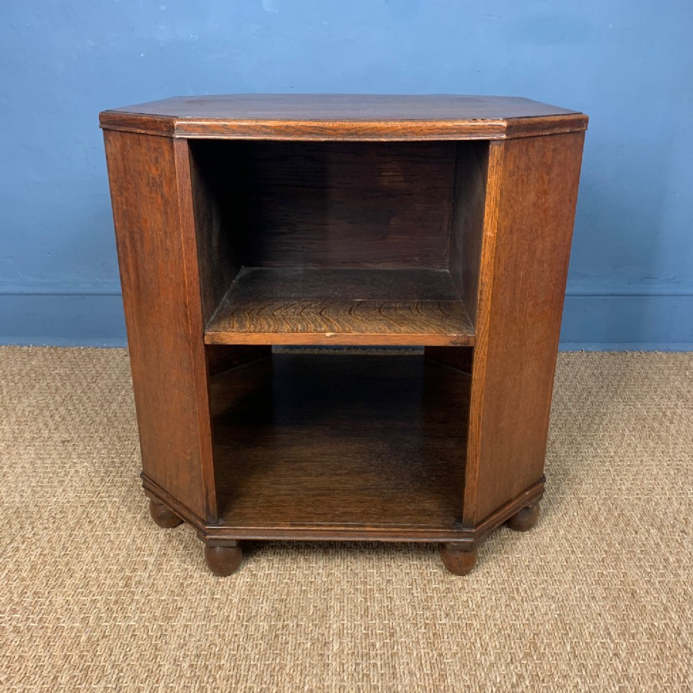 A Heals oak book table circa 1930 in fumed oak