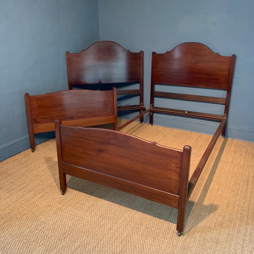 A pair of Heals mahogany single beds circa 1925