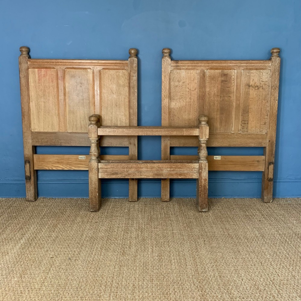 A pair of Heals limed oak Tilden design single beds circa 1930