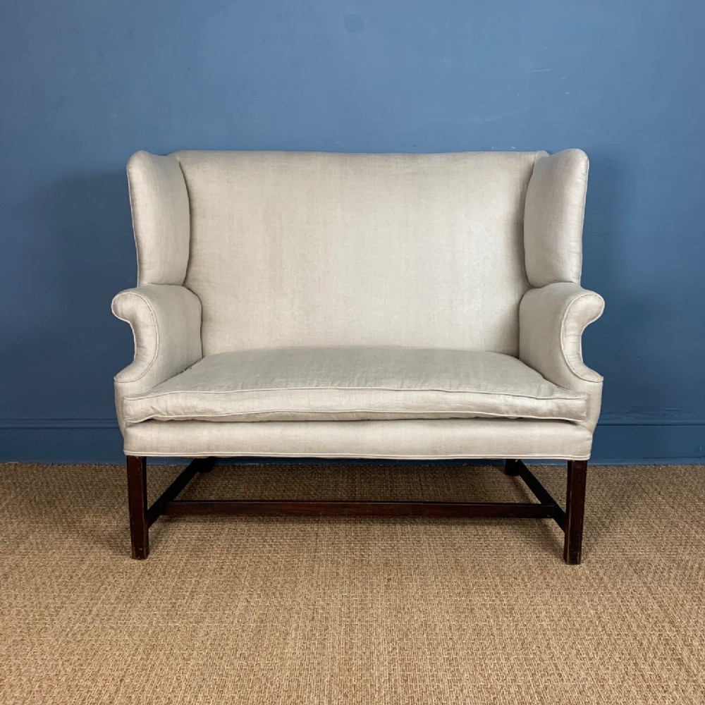 A late Victorian wing back sofa circa 1900 in excellent condition