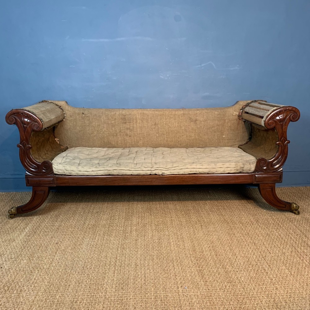 A George IV mahogany sofa circa 1825 in the Grecian style