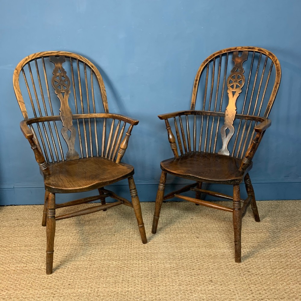 A pair of 19th c ash and elm wheel back high Windsor Chairs