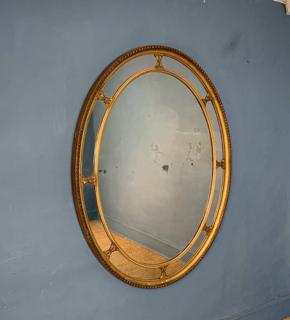 A large Victorian marginal border glass oval mirror circa 1870