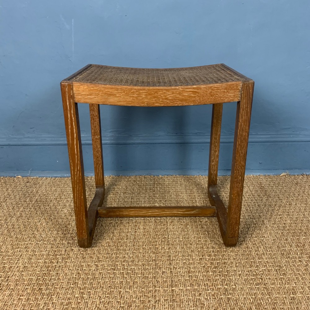 A Heals oak and caned stool c 1930