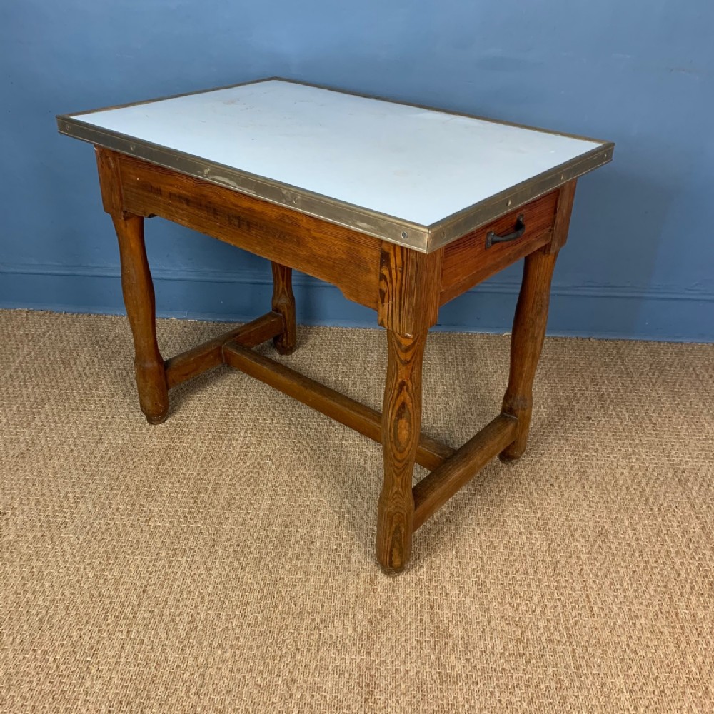 A West Country pine enamel and brass banded dairy table circa 1910