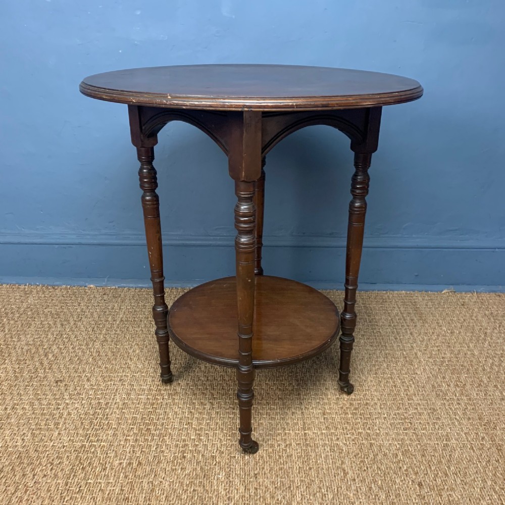 An Aesthetic movement mahogany two tiered table circa 1890