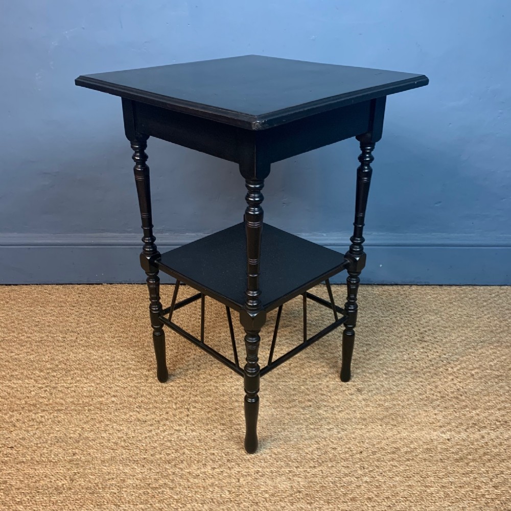An Aesthetic Movement ebonised E W Godwin two tier table c 1880